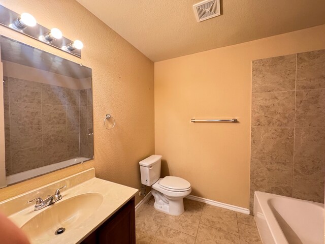 721 Prairie Creek Dr, Princeton, TX 75407 - full bathroom with toilet, a textured ceiling, vanity, independent shower and bath, and tile patterned flooring