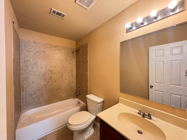 721 Prairie Creek Dr, Princeton, TX 75407 - full bathroom featuring tiled shower / bath, vanity, a textured ceiling, and toilet