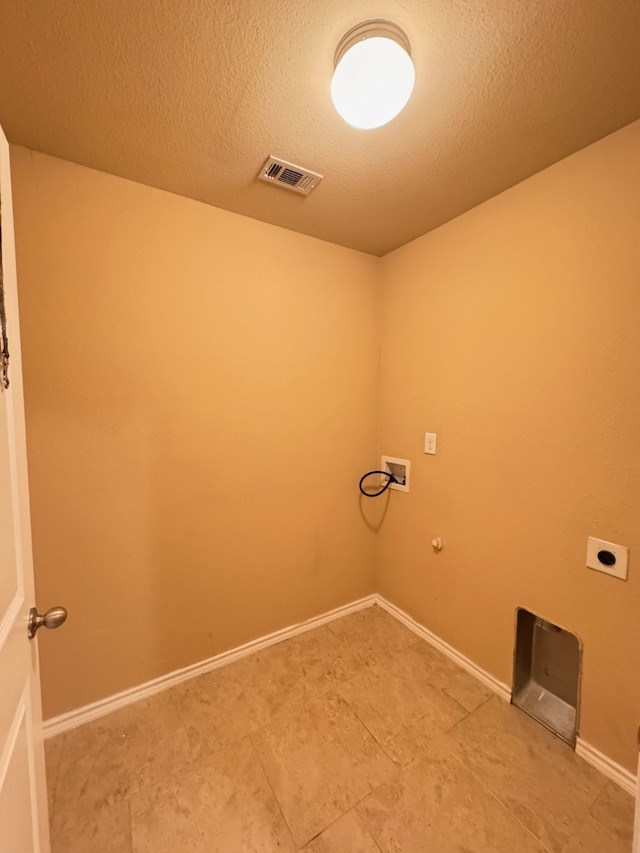 721 Prairie Creek Dr, Princeton, TX 75407 - laundry room with washer hookup, hookup for an electric dryer, hookup for a gas dryer, and a textured ceiling