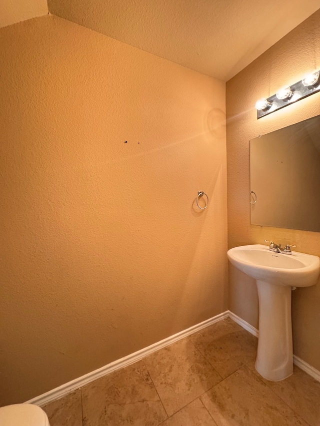 721 Prairie Creek Dr, Princeton, TX 75407 - bathroom with tile patterned flooring and a textured ceiling