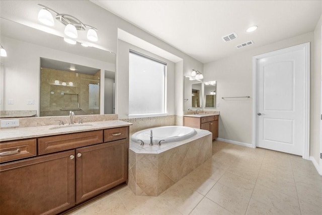 full bathroom with a garden tub, a stall shower, a sink, and visible vents