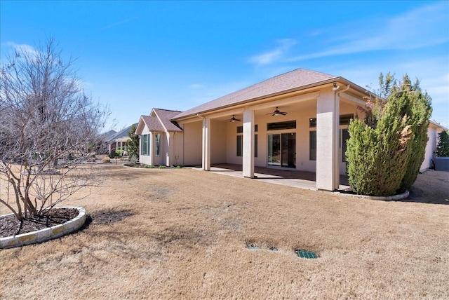 back of house featuring a ceiling fan, a patio area, and stucco siding