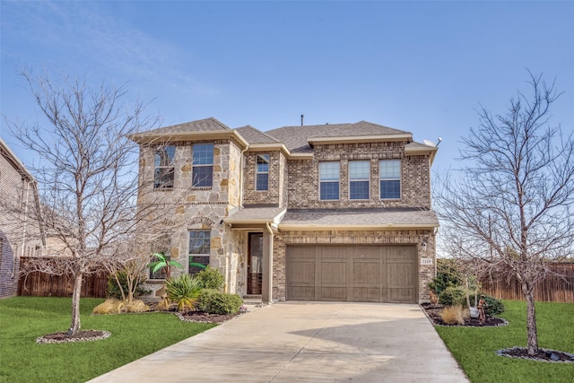 view of front of home with a garage and a front lawn