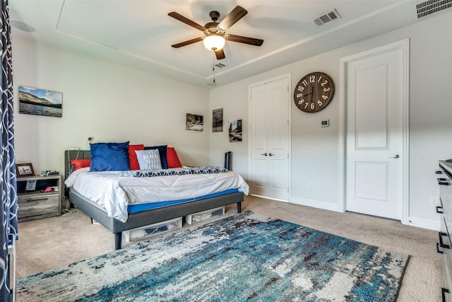 bedroom featuring ceiling fan and carpet