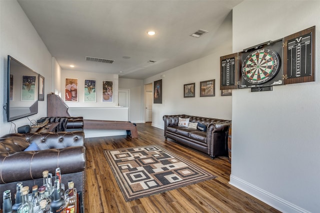 living room with dark hardwood / wood-style flooring