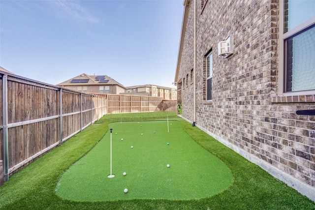 view of yard featuring an AC wall unit