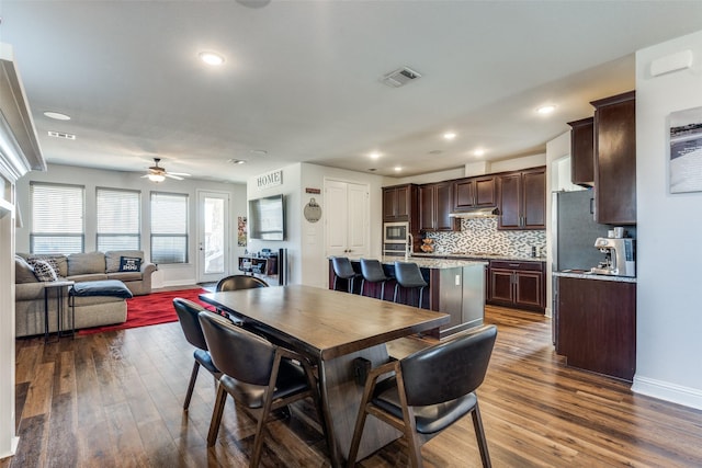 dining room featuring hardwood / wood-style flooring and ceiling fan