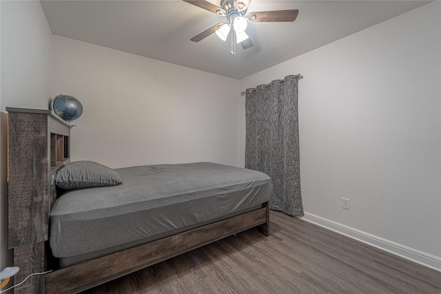 bedroom featuring wood-type flooring and ceiling fan