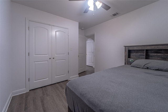 bedroom featuring hardwood / wood-style flooring, a closet, and ceiling fan