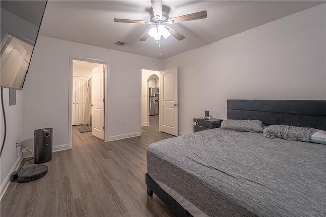 bedroom with wood-type flooring and ceiling fan