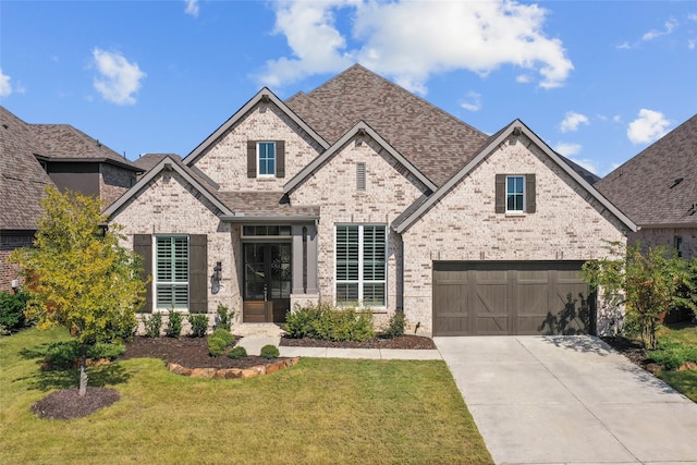 view of front facade with a garage and a front yard