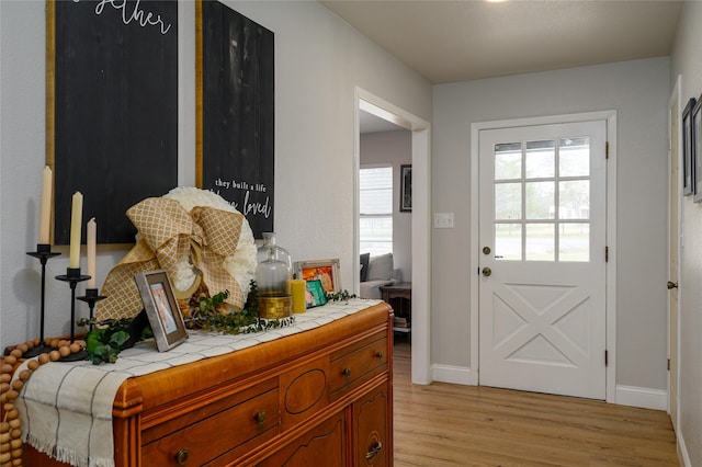 doorway with light hardwood / wood-style floors