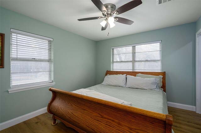 bedroom featuring hardwood / wood-style floors and ceiling fan