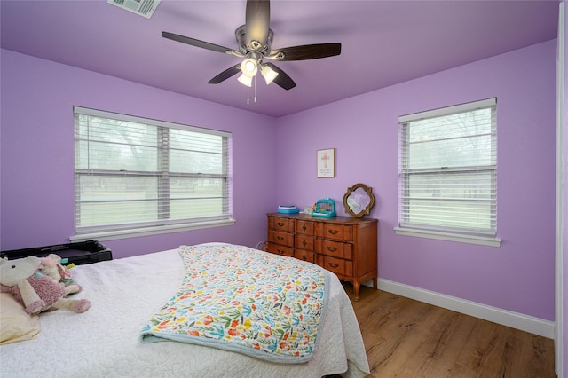 bedroom featuring ceiling fan and light hardwood / wood-style flooring