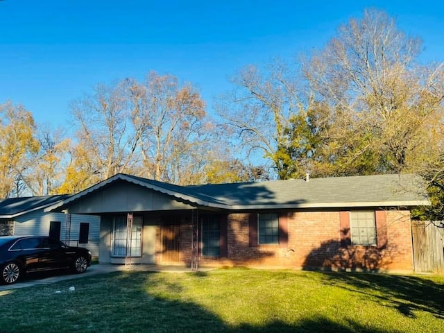 ranch-style home with a front yard