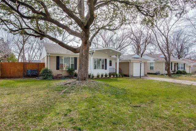 single story home featuring a garage and a front yard