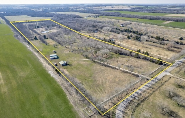 birds eye view of property featuring a rural view