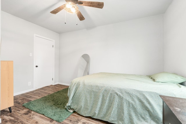 bedroom featuring wood-type flooring and ceiling fan