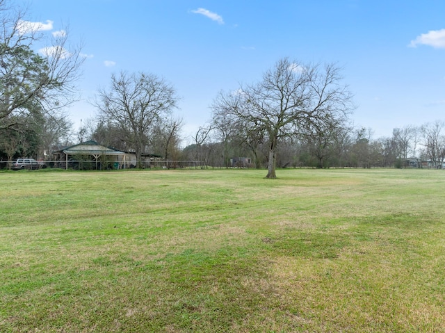 view of yard with a rural view