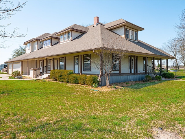 farmhouse with a garage, covered porch, and a front yard