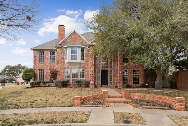 view of front of home with a front lawn