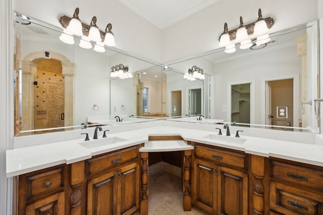 bathroom featuring an enclosed shower, ornamental molding, and vanity