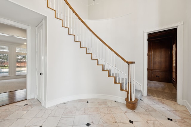 stairway with a towering ceiling