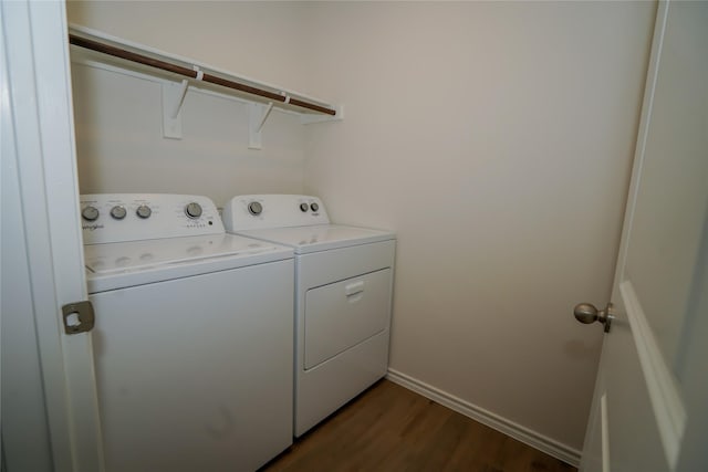 laundry area featuring independent washer and dryer and dark wood-type flooring