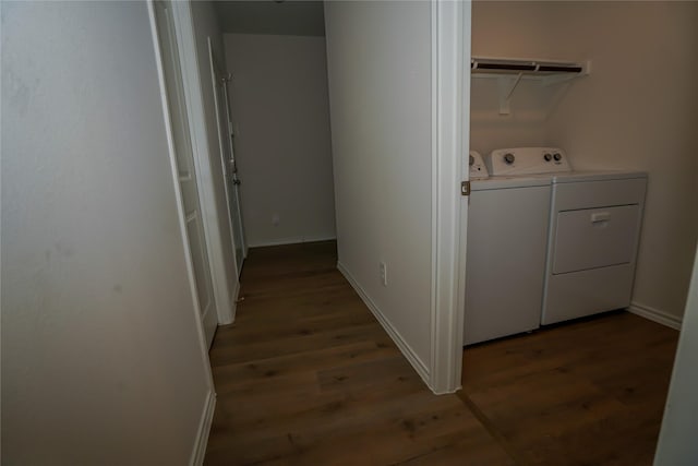 laundry area with washing machine and dryer and dark hardwood / wood-style flooring