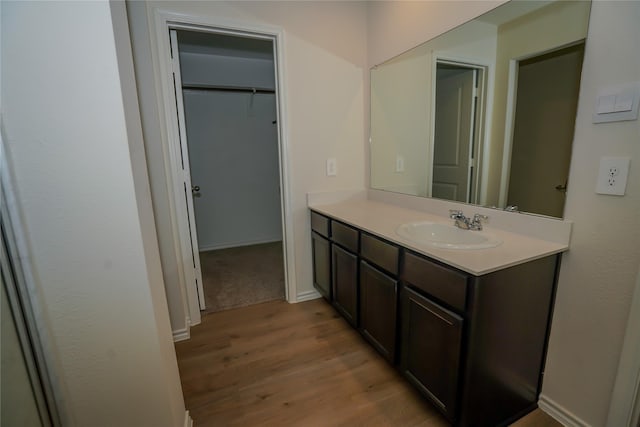 bathroom featuring vanity and wood-type flooring