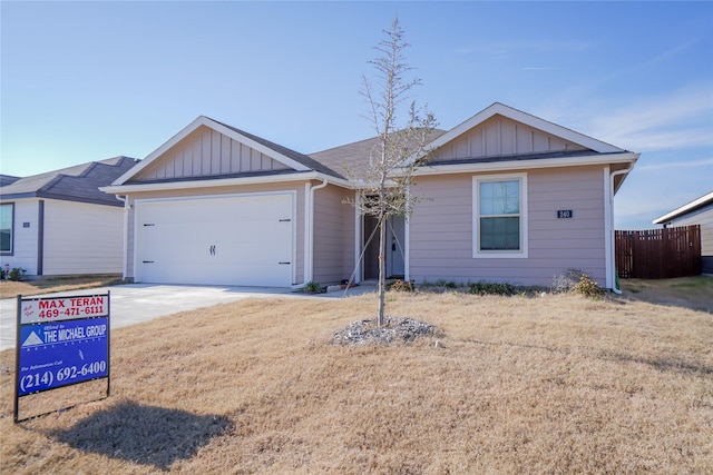 single story home with a front yard and a garage