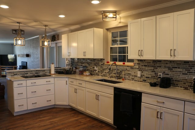 kitchen with sink, kitchen peninsula, white cabinetry, and black appliances