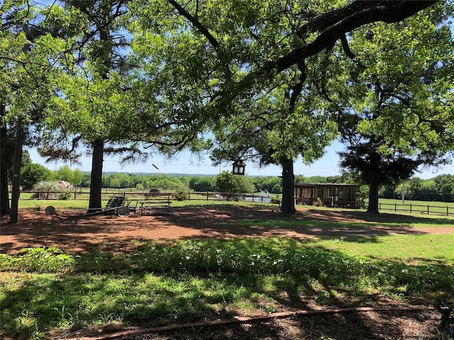 view of yard with a rural view