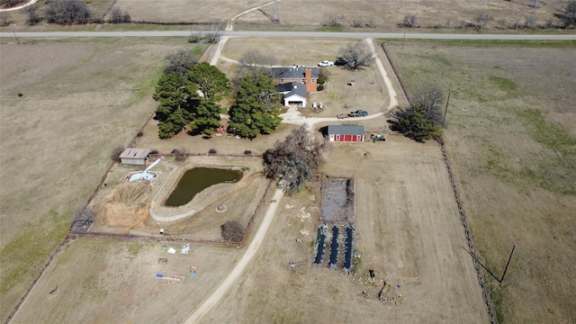 birds eye view of property featuring a rural view