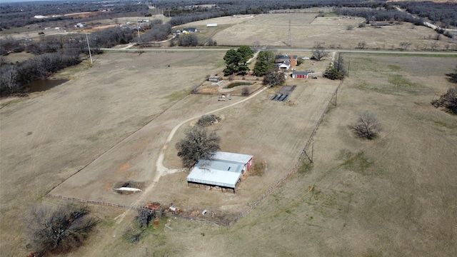 birds eye view of property featuring a rural view