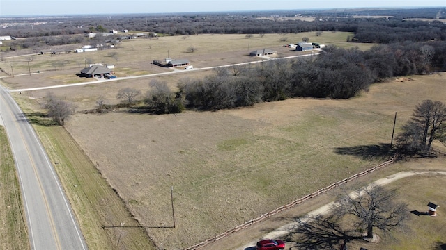 birds eye view of property featuring a rural view