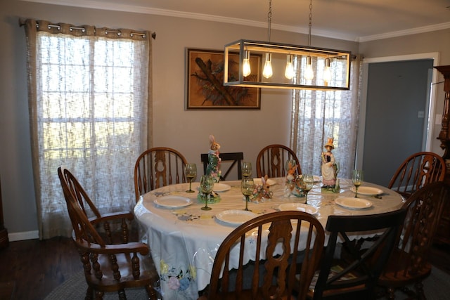 dining area featuring ornamental molding and wood-type flooring