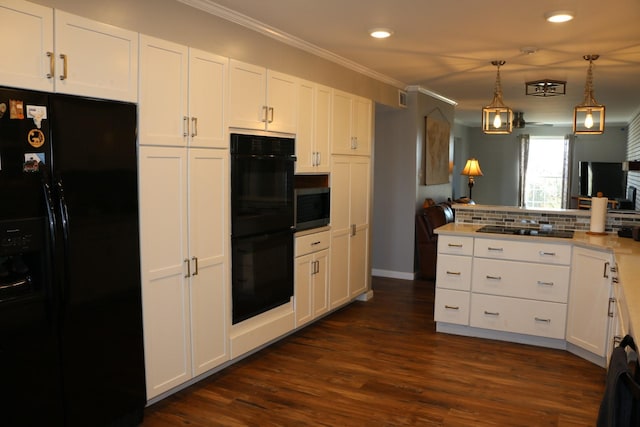 kitchen with ornamental molding, decorative light fixtures, white cabinetry, and black appliances