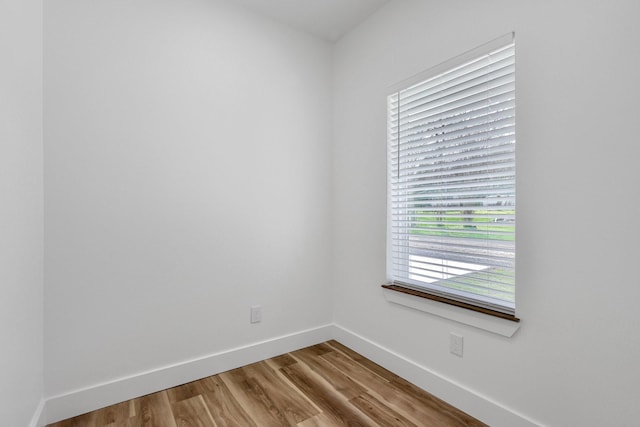 unfurnished room with light wood-type flooring