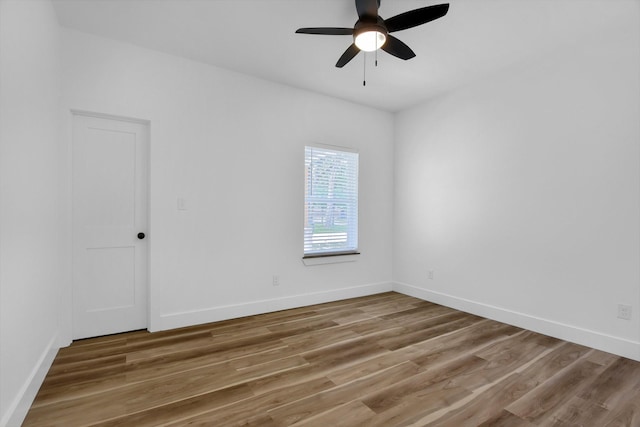 empty room featuring wood-type flooring and ceiling fan