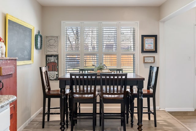 dining room with hardwood / wood-style flooring