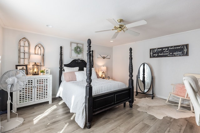 bedroom featuring ornamental molding, wood-type flooring, and ceiling fan