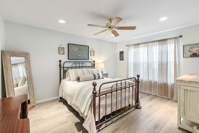 bedroom featuring ceiling fan and light wood-type flooring