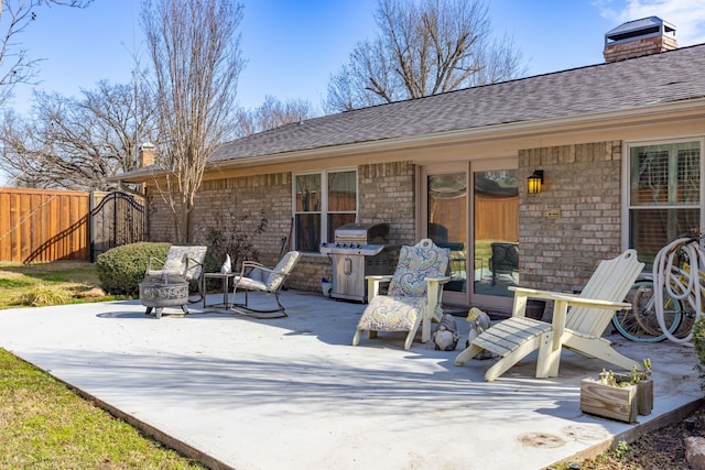 view of patio / terrace featuring area for grilling and a fire pit