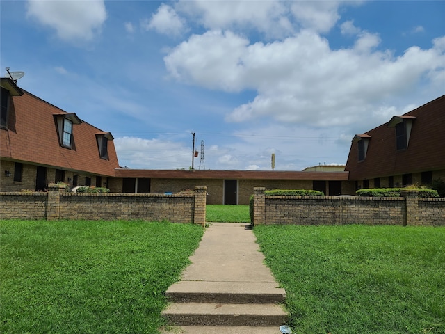 view of community with a yard