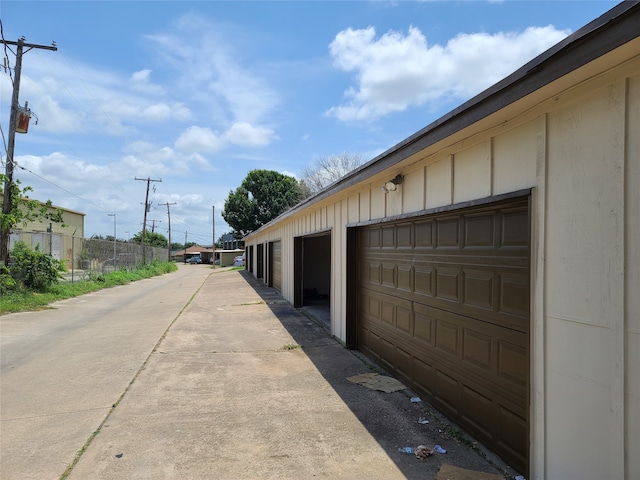 garage with fence