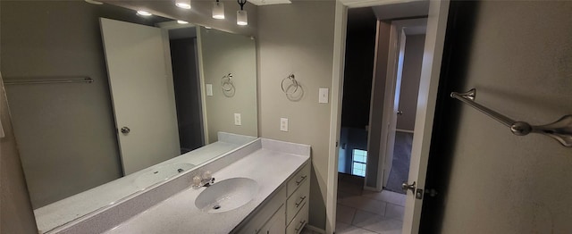 bathroom with tile patterned flooring and vanity