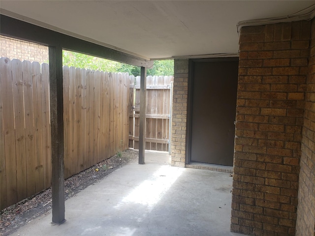 view of patio featuring fence