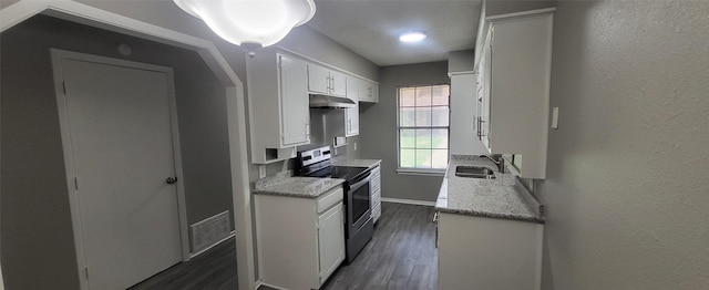 kitchen featuring dark wood-style floors, white cabinets, a sink, stainless steel range with electric stovetop, and under cabinet range hood