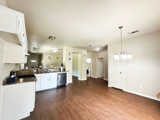 kitchen featuring dishwasher, white cabinetry, dark hardwood / wood-style flooring, washer / clothes dryer, and kitchen peninsula